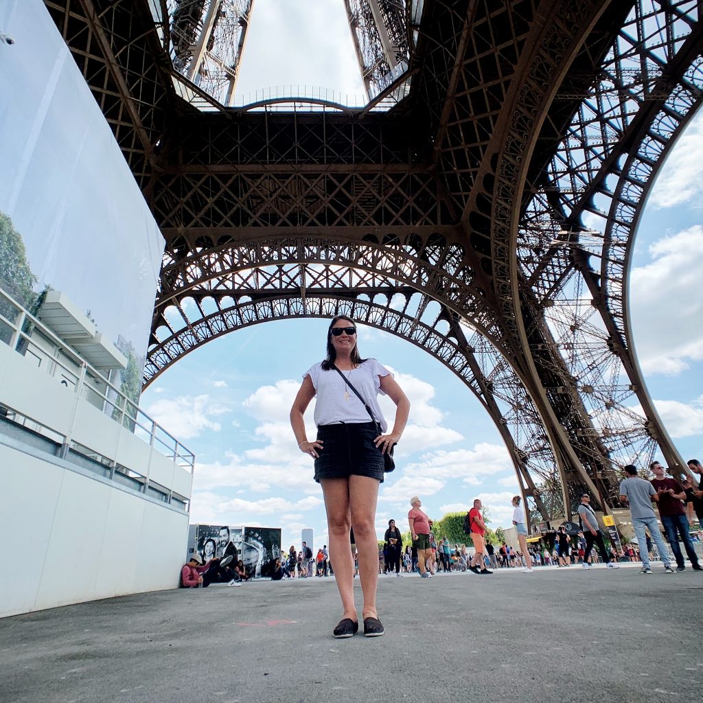Standing under the Eiffel Tower