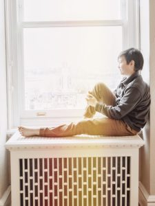 Boy sitting at window Fairmont Empress